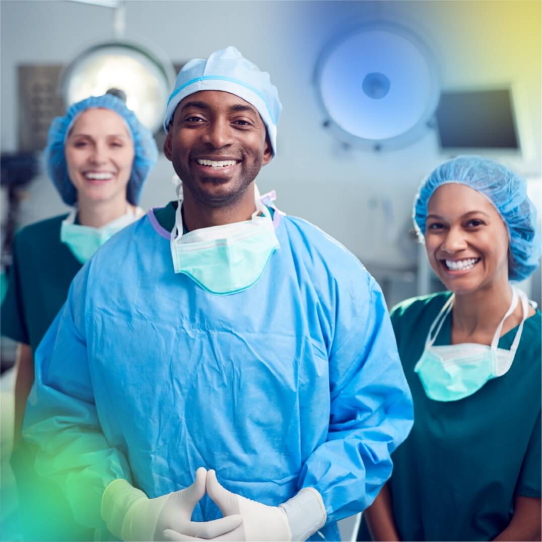 Mixed group of medical workers dressed in scrubs and smiling
